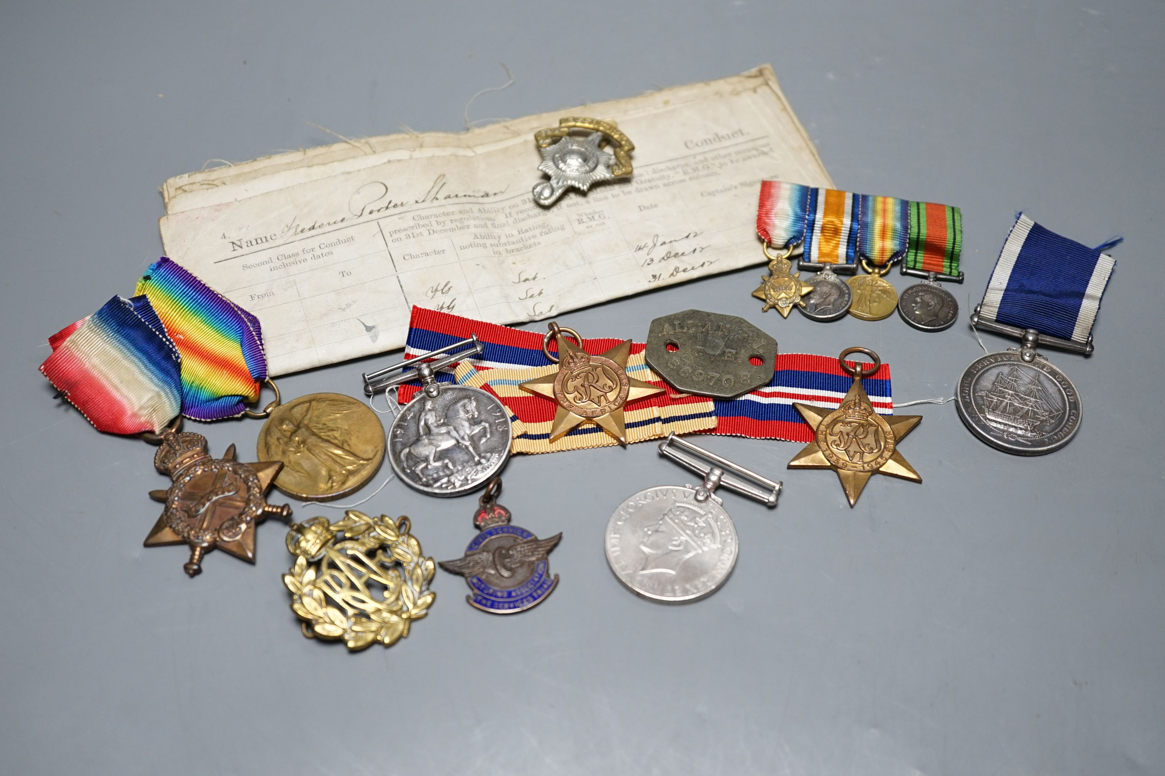 A WWI medal trio awarded to J. 11048 F. P. SHARMAN. A.B. R.N., a George V Royal Navy long service and good conduct medal awarded to M.38014 F. P. SHARMAN. R. P O. H.M.S. REPULSE, a WWI miniature dress medal group, a WWII